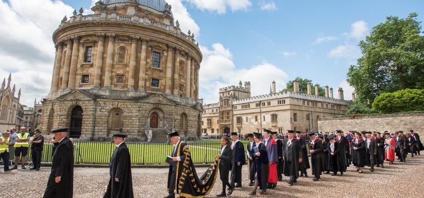 Radcliffe Camera with University procession passing in front
